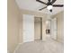 Neutral bedroom with ceiling fan and walk-in closet and en-suite bathroom close by at 7931 Mineral Peak St, Las Vegas, NV 89166