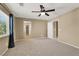 Large bedroom with neutral walls, carpet floors, and a ceiling fan at 7931 Mineral Peak St, Las Vegas, NV 89166