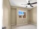 Bright bedroom featuring a window for natural light and a ceiling fan for ventilation, offering comfort at 7931 Mineral Peak St, Las Vegas, NV 89166