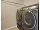 Modern, dark-colored Samsung washer and dryer set in a dedicated laundry space, offering convenience and efficiency at 7931 Mineral Peak St, Las Vegas, NV 89166