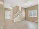 Open living area showcasing tiled floors, stairs, neutral walls, and ample natural light at 7931 Mineral Peak St, Las Vegas, NV 89166