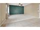 Expansive living area with a dark accent wall, carpet and tile flooring, and natural light at 7931 Mineral Peak St, Las Vegas, NV 89166