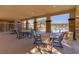 Comfortable patio with shaded seating, perfect for outdoor dining and relaxation by the pool at 7931 Mineral Peak St, Las Vegas, NV 89166