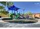 Community playground features slides, climbing wall, and shaded play area at 7931 Mineral Peak St, Las Vegas, NV 89166
