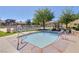 Inviting community spa area with lounge chairs and landscaping offers a place to relax at 7931 Mineral Peak St, Las Vegas, NV 89166