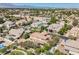Wide aerial neighborhood view showcasing various home styles, mature trees, and well-kept lawns at 7947 Lookout Rock Cir, Las Vegas, NV 89129