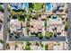 An aerial view displays a well-maintained home and neighborhood with manicured lawns and pools at 7947 Lookout Rock Cir, Las Vegas, NV 89129