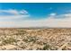 A scenic aerial view captures a residential area with the city skyline in the distance at 7947 Lookout Rock Cir, Las Vegas, NV 89129