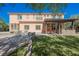 Beautiful backyard with a covered pergola, lush lawn, and well-maintained landscaping at 7947 Lookout Rock Cir, Las Vegas, NV 89129