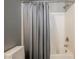 Bathroom featuring a shower-tub combo with neutral gray shower curtain at 7947 Lookout Rock Cir, Las Vegas, NV 89129