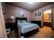 Comfortable bedroom with elegant wall decor and dark wood furniture at 7947 Lookout Rock Cir, Las Vegas, NV 89129