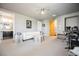 Open bonus room with plush carpet, white sofa, and adjacent bathroom at 7947 Lookout Rock Cir, Las Vegas, NV 89129