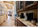 Convenient butler's pantry with granite countertops and custom cabinetry at 7947 Lookout Rock Cir, Las Vegas, NV 89129