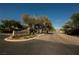 Inviting entrance to the Lamplight Glen community with manicured landscaping at 7947 Lookout Rock Cir, Las Vegas, NV 89129