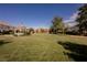 Scenic community park featuring a charming gazebo, lush lawn, mature trees and well maintained landscaping at 7947 Lookout Rock Cir, Las Vegas, NV 89129