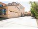 Spacious concrete driveway leading to a large garage and gated side yard at 7947 Lookout Rock Cir, Las Vegas, NV 89129