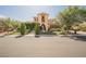 A two-story home features a fountain, manicured landscaping, and a charming exterior at 7947 Lookout Rock Cir, Las Vegas, NV 89129