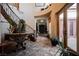 Lovely foyer with stairs, marble table, and tile floors that extend through the entry and beyond at 7947 Lookout Rock Cir, Las Vegas, NV 89129