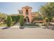 Charming two-story home with landscaped yard and a decorative water fountain at 7947 Lookout Rock Cir, Las Vegas, NV 89129