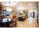 Spacious kitchen features a large island with seating, tiled floors, and wooden cabinetry with granite countertops at 7947 Lookout Rock Cir, Las Vegas, NV 89129
