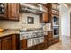 This gourmet kitchen features stainless steel appliances, granite countertops, and custom cabinetry at 7947 Lookout Rock Cir, Las Vegas, NV 89129