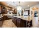 Gourmet kitchen features a large island, stainless steel appliances, granite countertops, and custom cabinetry at 7947 Lookout Rock Cir, Las Vegas, NV 89129