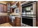 Gourmet kitchen features stainless steel appliances and beautiful wood cabinetry at 7947 Lookout Rock Cir, Las Vegas, NV 89129
