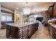 Spacious kitchen island with granite countertop and pendant lighting at 7947 Lookout Rock Cir, Las Vegas, NV 89129