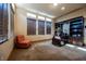 Spacious office with built-in shelving and a comfortable sitting area at 7947 Lookout Rock Cir, Las Vegas, NV 89129