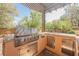 Outdoor kitchen boasts a stainless steel grill and ample counter space at 7947 Lookout Rock Cir, Las Vegas, NV 89129