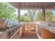 Well-equipped outdoor kitchen featuring a built-in grill, sink, and countertop space at 7947 Lookout Rock Cir, Las Vegas, NV 89129