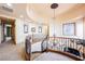 Grand foyer showcasing a spiral staircase with wrought iron railing and a statement chandelier at 7947 Lookout Rock Cir, Las Vegas, NV 89129
