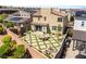 Aerial view showcases a home's backyard, featuring an outdoor kitchen, dining area and desert landscaping at 812 Stannard Ct, Henderson, NV 89052