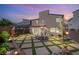 Beautiful backyard featuring a paved patio, a large dining table, and mature landscaping with string lights at 812 Stannard Ct, Henderson, NV 89052