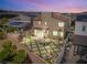 Beautiful backyard with patio, water feature, outdoor kitchen, and a grassy area for entertaining and relaxation at 812 Stannard Ct, Henderson, NV 89052
