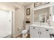 Clean bathroom with shower, white vanity, and decor at 812 Stannard Ct, Henderson, NV 89052