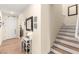 Inviting entryway with wood-look floors, a staircase, neutral walls, and decorative accents creating a welcoming atmosphere at 812 Stannard Ct, Henderson, NV 89052