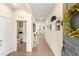 Elegant hallway with wood floors and decorated walls leading to a bright, open space at 812 Stannard Ct, Henderson, NV 89052