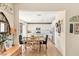 Inviting dining area with open view to modern kitchen with stainless steel appliances at 812 Stannard Ct, Henderson, NV 89052