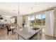 Open kitchen design featuring granite countertops, an island with a sink, and sliding doors leading to the patio at 812 Stannard Ct, Henderson, NV 89052