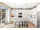 Bright kitchen with white cabinets, granite countertops, and stainless steel appliances at 812 Stannard Ct, Henderson, NV 89052