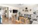 Comfortable living room with wood floors, a gray sofa, and a ceiling fan at 812 Stannard Ct, Henderson, NV 89052