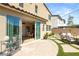 A backyard patio with large sliding glass door and outdoor dining set for elegant outdoor gatherings at 812 Stannard Ct, Henderson, NV 89052
