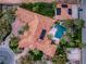 Stunning aerial view showcasing a private pool, lush landscaping, and unique architectural details, creating a luxurious outdoor oasis at 8130 Cassian Ct, Las Vegas, NV 89129