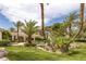 Lush backyard featuring palm trees, meticulous landscaping, and a pristine pool, creating an ideal setting for outdoor relaxation at 8130 Cassian Ct, Las Vegas, NV 89129