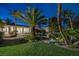 Backyard pool with mature landscaping, grass and water features at 8130 Cassian Ct, Las Vegas, NV 89129