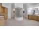 Spacious primary bathroom featuring wood cabinets, granite counters and a large walk-in closet at 8130 Cassian Ct, Las Vegas, NV 89129