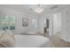 Bright bedroom featuring a decorative light fixture, and plantation shutters for a warm, inviting ambiance at 8130 Cassian Ct, Las Vegas, NV 89129