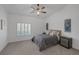 Bright bedroom with a ceiling fan, a window with shutters, and modern furniture at 8130 Cassian Ct, Las Vegas, NV 89129
