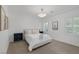 Bright bedroom featuring two windows and a decorative chandelier for a serene ambiance at 8130 Cassian Ct, Las Vegas, NV 89129